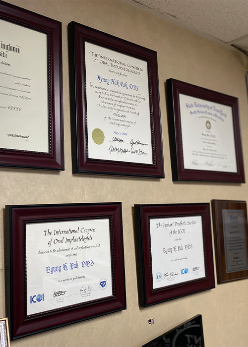Dr. Pak's awards hanging on the wall
